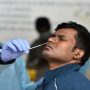 India reports 58,077 new COVID-19 cases
