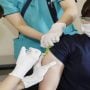Japan to quickly raise daily booster shots to 1 mln as Omicron runs rampant