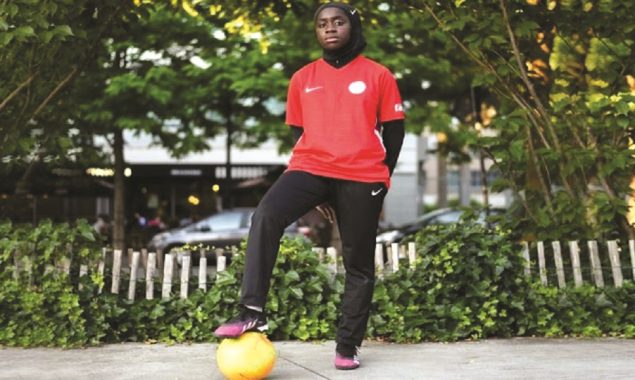 French minister condemns headscarf ban for Muslim footballers