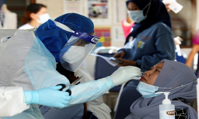 Malaysia reports 31,199 new COVID-19 cases in highest daily spike