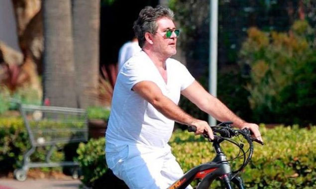 Simon Cowell hospitalized after a second e-bike crash due to a broken arm