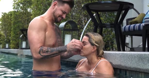 Carl Woods pops Katie Price’s spots for her while they relax in the pool on their Thailand vacation