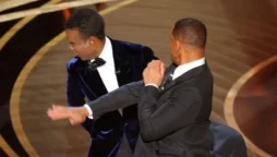 Will Smith slpas Chris Rock on the Oscars stage