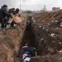 Harrowing images show Ukrainians burying loved ones in mass graves following the ‘apocalyptic’ Russian bombing of Mariupol.