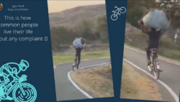 Netizens stunned: A man’s bicycle ride with a bundle on his head