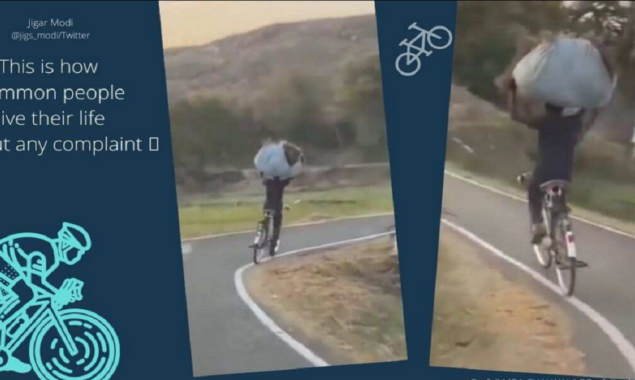 Netizens stunned: A man’s bicycle ride with a bundle on his head