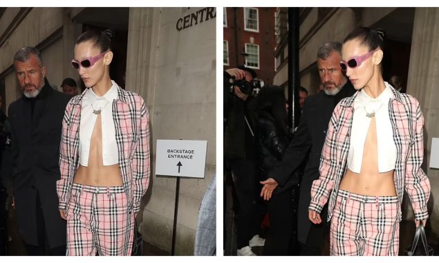 Bella Hadid shows off her toned midriff in a cropped white shirt beneath a pink plaid jacket