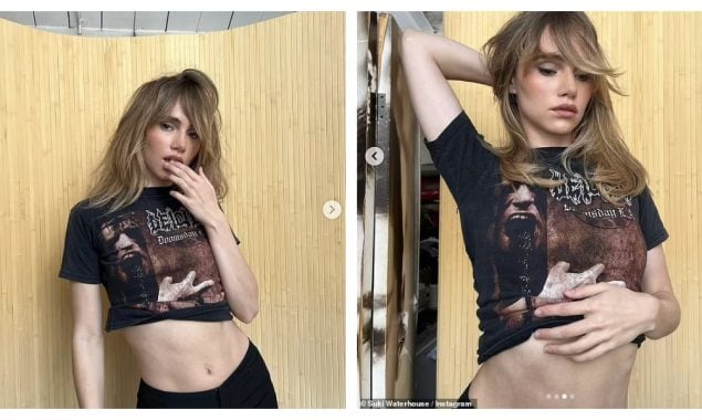Suki Waterhouse shows off her toned abs while posing in a band T-shirt