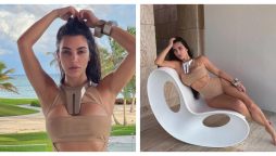 Kim Kardashian flaunts her curves in a nude swimsuit for makeup-free photos following ex Kanye West’s disturbing new post