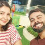 Virat Kohli smiles cheekily as he poses with wife Anushka Sharma