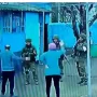 Fearless elderly Ukrainians confront gun-toting Russian troops who barged into their home and kicked them out