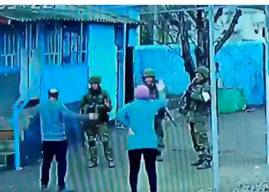 Fearless elderly Ukrainians confront gun-toting Russian troops who barged into their home and kicked them out