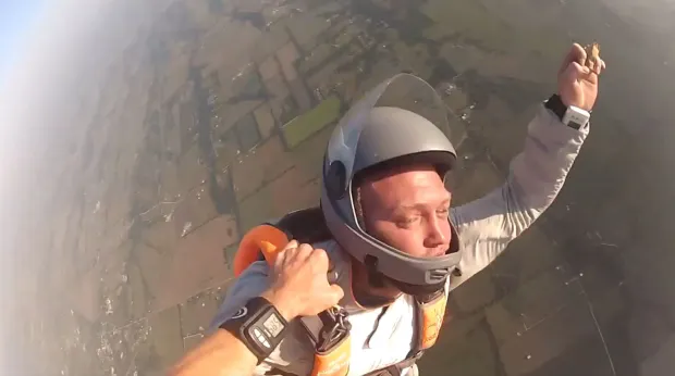 Terrifying moment skydiver KNOCKED OUT sending him into death spiral before hero instructor catches him and pulls chute