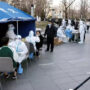 China locks down city of 9 million as virus ripples across country