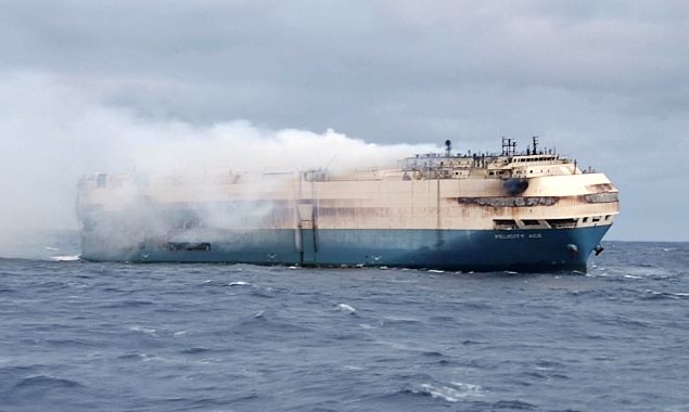A cargo ship carrying Porsches and Lamborghinis catches fire and sinks.