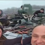 ‘We Did It’: Ukrainians cheer as they ride in a captured Russian tank