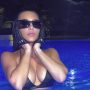 Kim Kardashian Accessorized Her String Bikini with a Surprising Pool Accessory