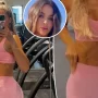 Khloé Kardashian shows off her abs while working out in a matching pink outfit