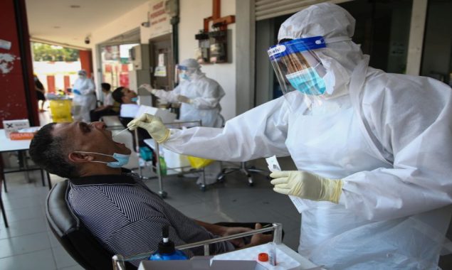 Malaysia reports 32,800 new COVID-19 infections, 76 new deaths