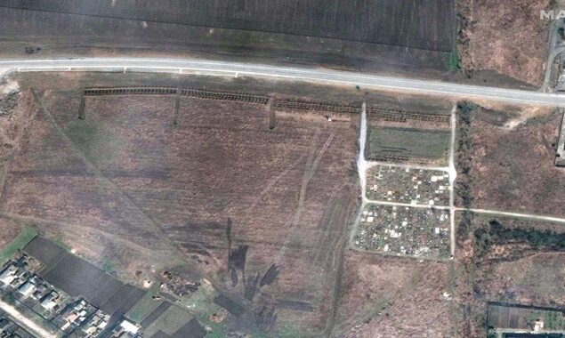 Ukrainian officials and satellite photographs point to indications of mass graves, outside Mariupol