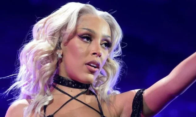 Doja Cat makes a bold appearance on the Grammys 2022 red carpet in a transparent skirt