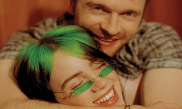 Billie Eilish and Finneas cheers for Jon Batiste as he performs his single Freedom