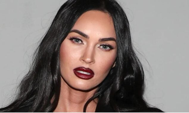 Megan Fox attended Kourtney Kardashian and Travis Barker’s wedding in black corseted gown.