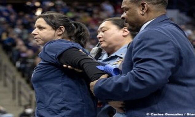 NBA Games: Protestor glues his hand to the court