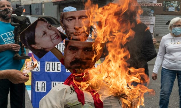 ‘Judas’ Putin and Maduro in Caracas