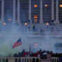 Trump supporters react to tear gas amid police clash
