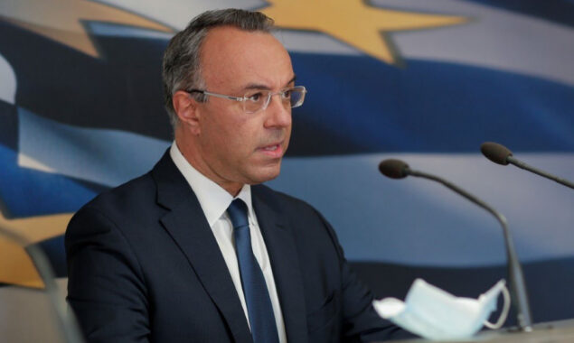 Greece repays last tranche of IMF bailout loans early, finance minister