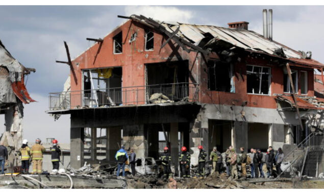 Air strikes hit western Ukraine as Russia forces mass in the east