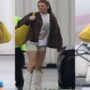 Kendall Jenner wears white shorts and cowboy boots as she boards