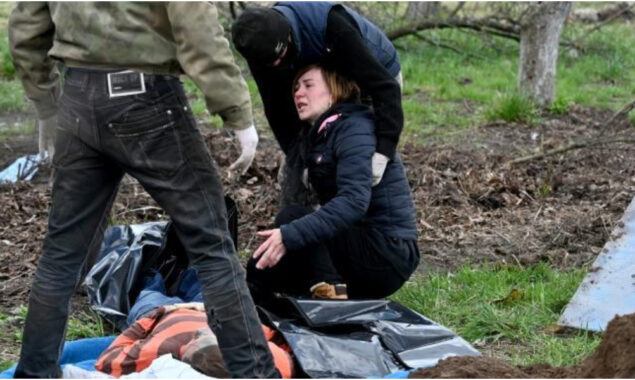 CORRECTED: On the trail of the dead in a Ukrainian village
