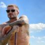 Shirtless David Beckham asks daring question for Victoria as he shows off home-made cake