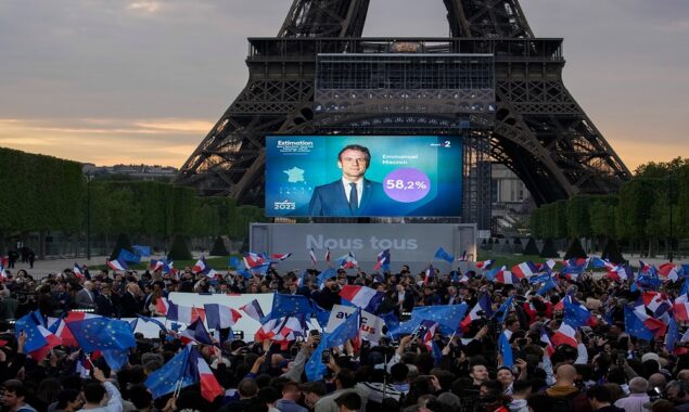 supporters enjoy victory of Emmanuel Macron under Eiffel Tower