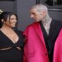Fans of Kourtney Kardashian believe she is PREGNANT after noticing a ‘bump’ during her PDA-filled Grammys date with Travis Barker