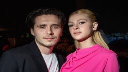 In a hot shot, Brooklyn Beckham enjoys a french fry with ‘wifey’ Nicola Petlz