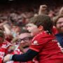 ‘It’s amazing, Dad!’: the Liverpool fans who loaned their passes to their children