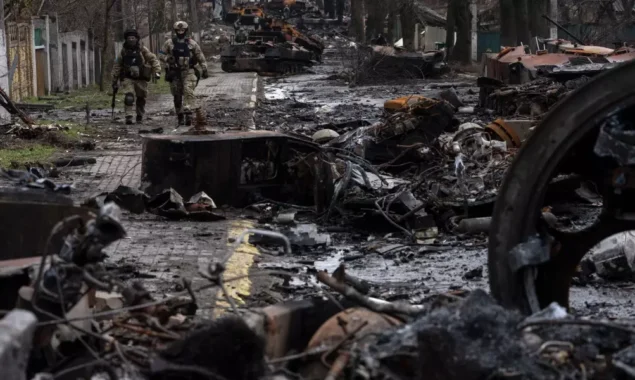 Ukrainian authorities are looking into the deaths of citizens discovered buried beside a highway
