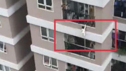 Watch: A man puts his life at risk to save a toddler from falling 100 feet