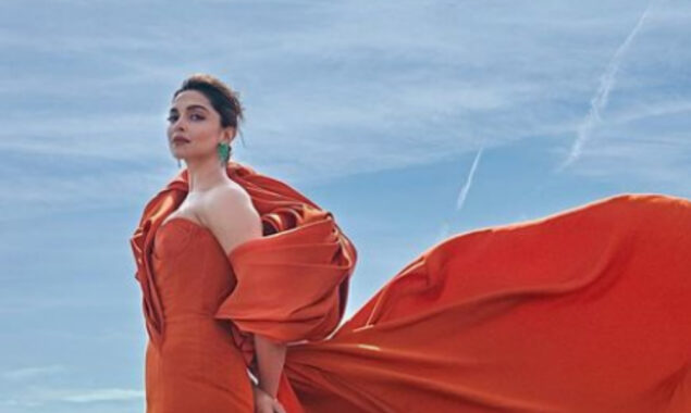 Deepika Padukone brings regal finesse & some skin in an orange gown