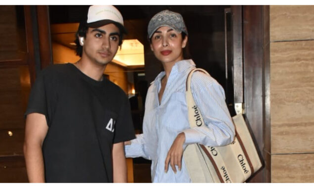 Malaika Arora twins with her son Arhaan Khan, and both wear elegant headgear on their outings.