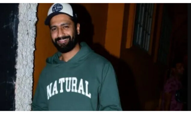 Vicky Kaushal poses with photographers as he walks around the city.