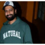 Vicky Kaushal poses with photographers as he walks around the city.