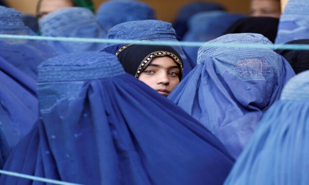 Taliban order Afghan women to cover fully in public