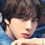 Jin of BTS shows off his cast-free hand after surgery