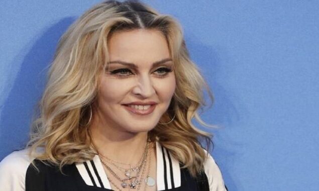 Madonna poses with four of her children as she promotes her new art project, “A Family Affair.”