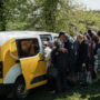 Pensioners swarm cash vans under fire at Ukraine front