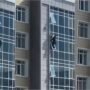 Viral video of man risking his life to save a kid hanging from a building in Kazakhstan